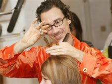 A hairdresser trimming someone's hair (http://www.bbc.co.uk/schools/gcsebitesize/business/images/hairdressing.jpg)